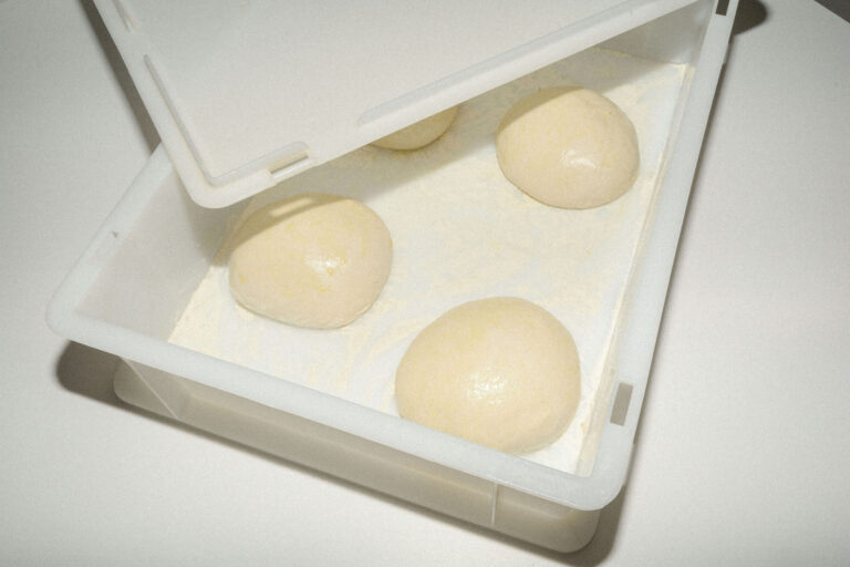 pizza dough balls in refrigerator container